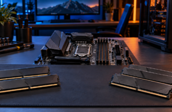 Desktop memory modules arranged beside the RAM slots of an open PC motherboard