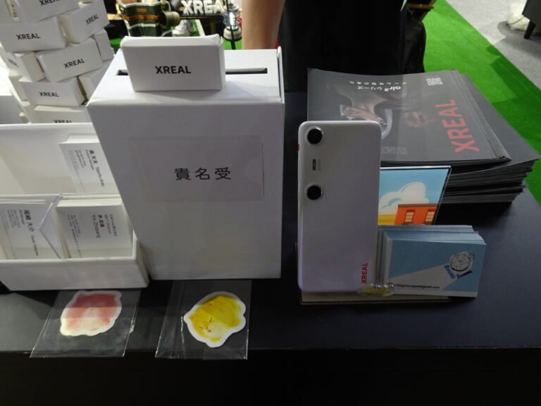Rear of a white XREAL Beam Pro with two spatial cameras, displayed at Tokyo Game Show 2024